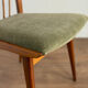 Scandinavian chairs with green velvet upholstery.