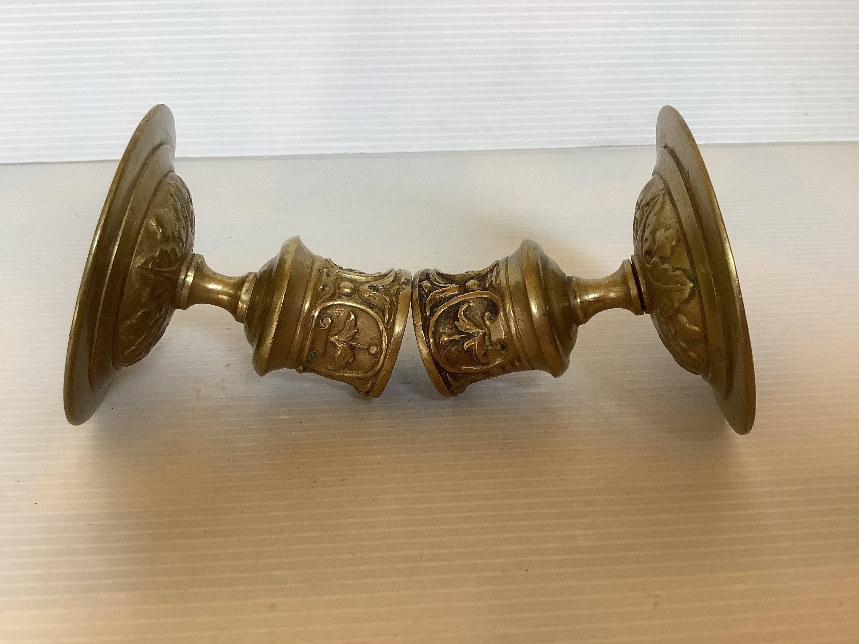 Pair of worked brass candlesticks