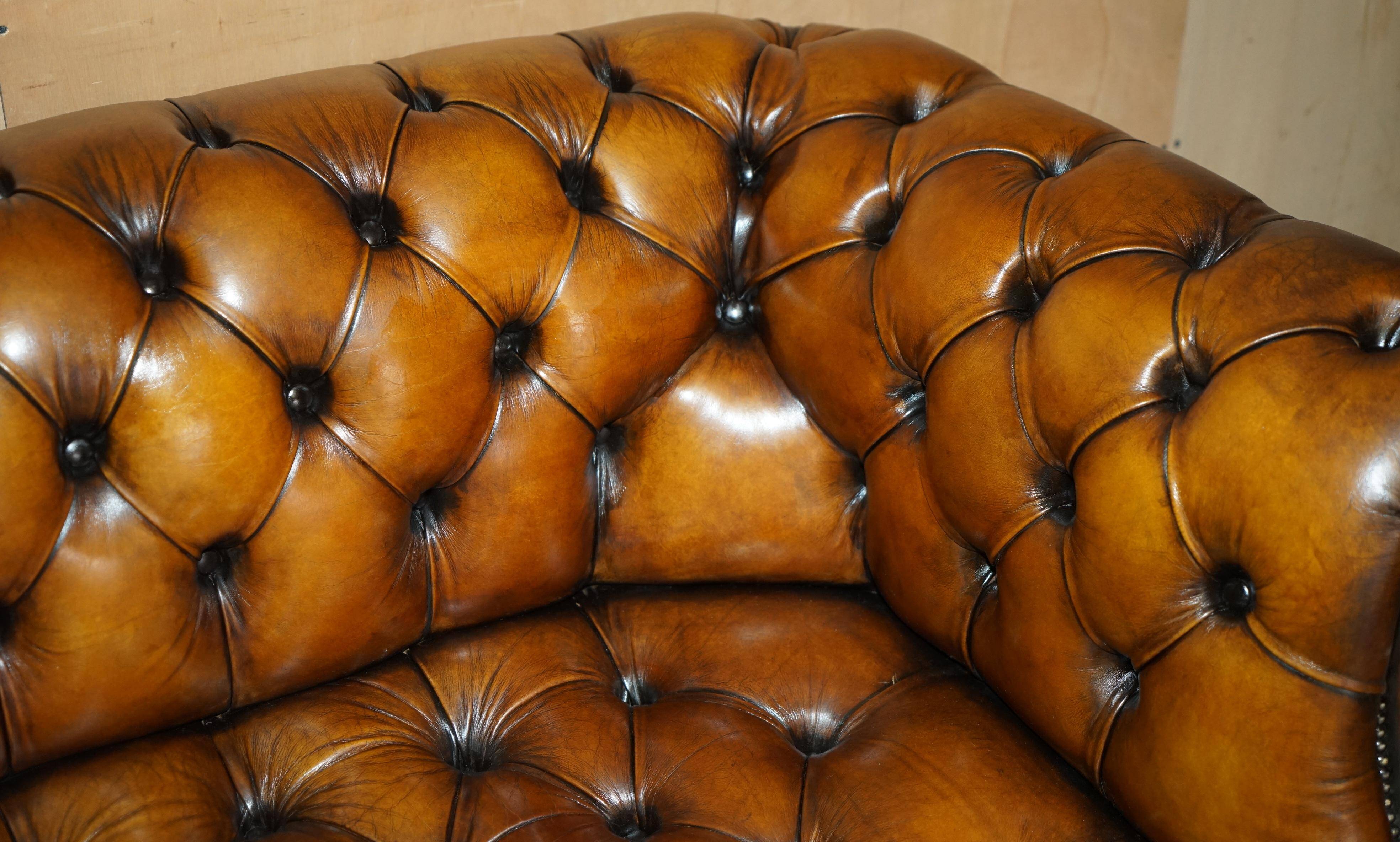 Vintage Chesterfield serpentine luxury sofa in restored leather