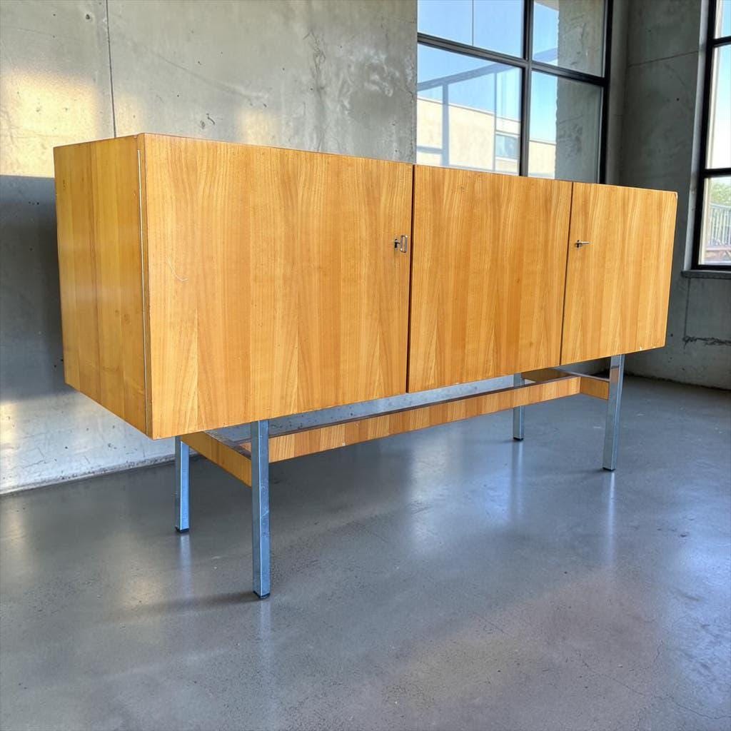 Vintage wooden storage cabinet with chrome legs