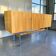 Vintage wooden storage cabinet with chrome legs