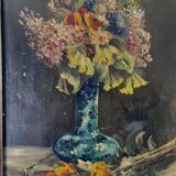 Still life with vase and bouquets of flowers