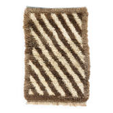 Tapis Tulu noué à la main en laine naturelle non teinte.