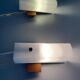 Mid-century wall lights in white plexiglass with a wooden base, 1960s, Germany.
