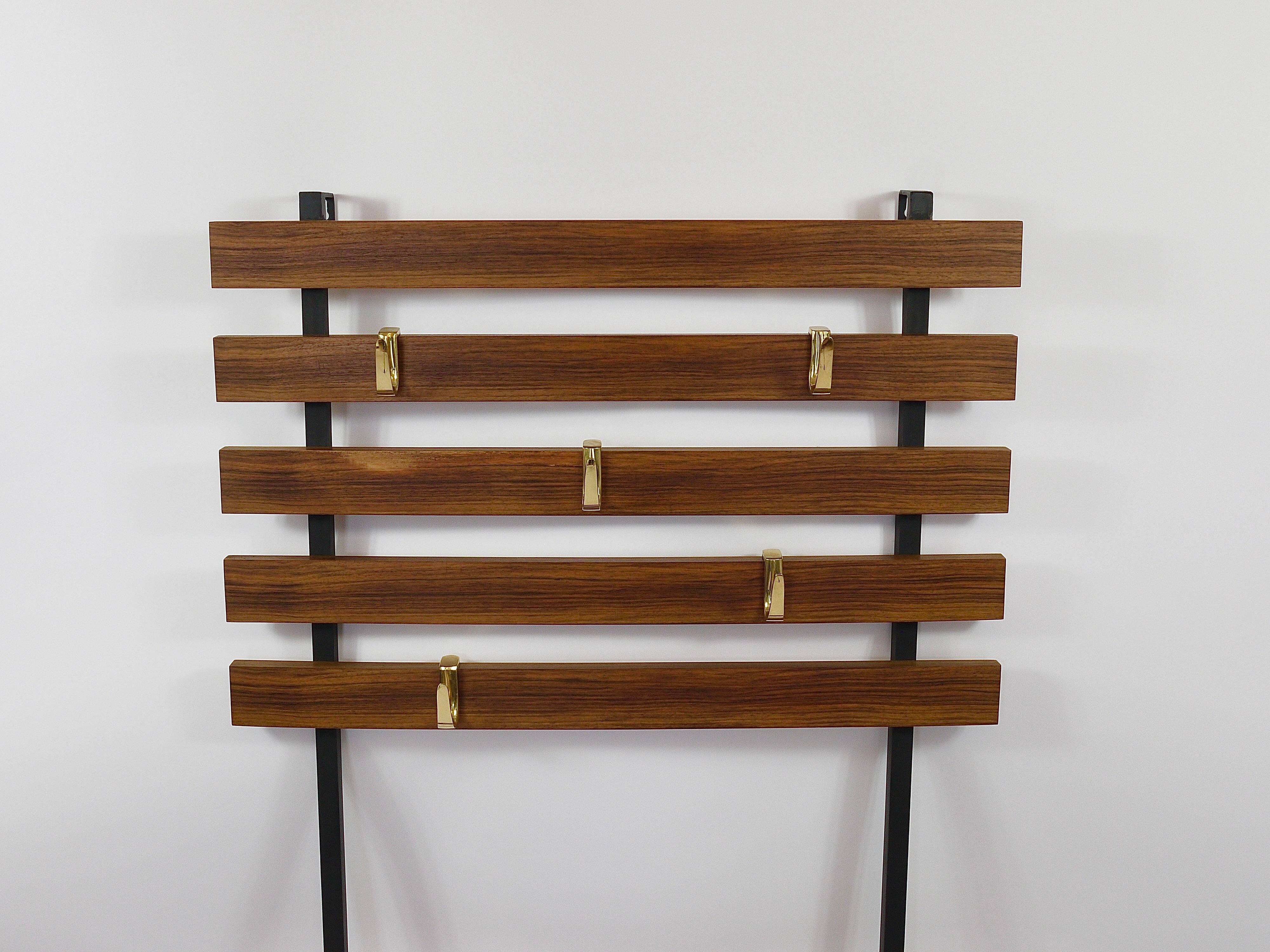Wall coat rack by Carl Aubock with 5 brass hooks, walnut, iron, Austria, 1950s.