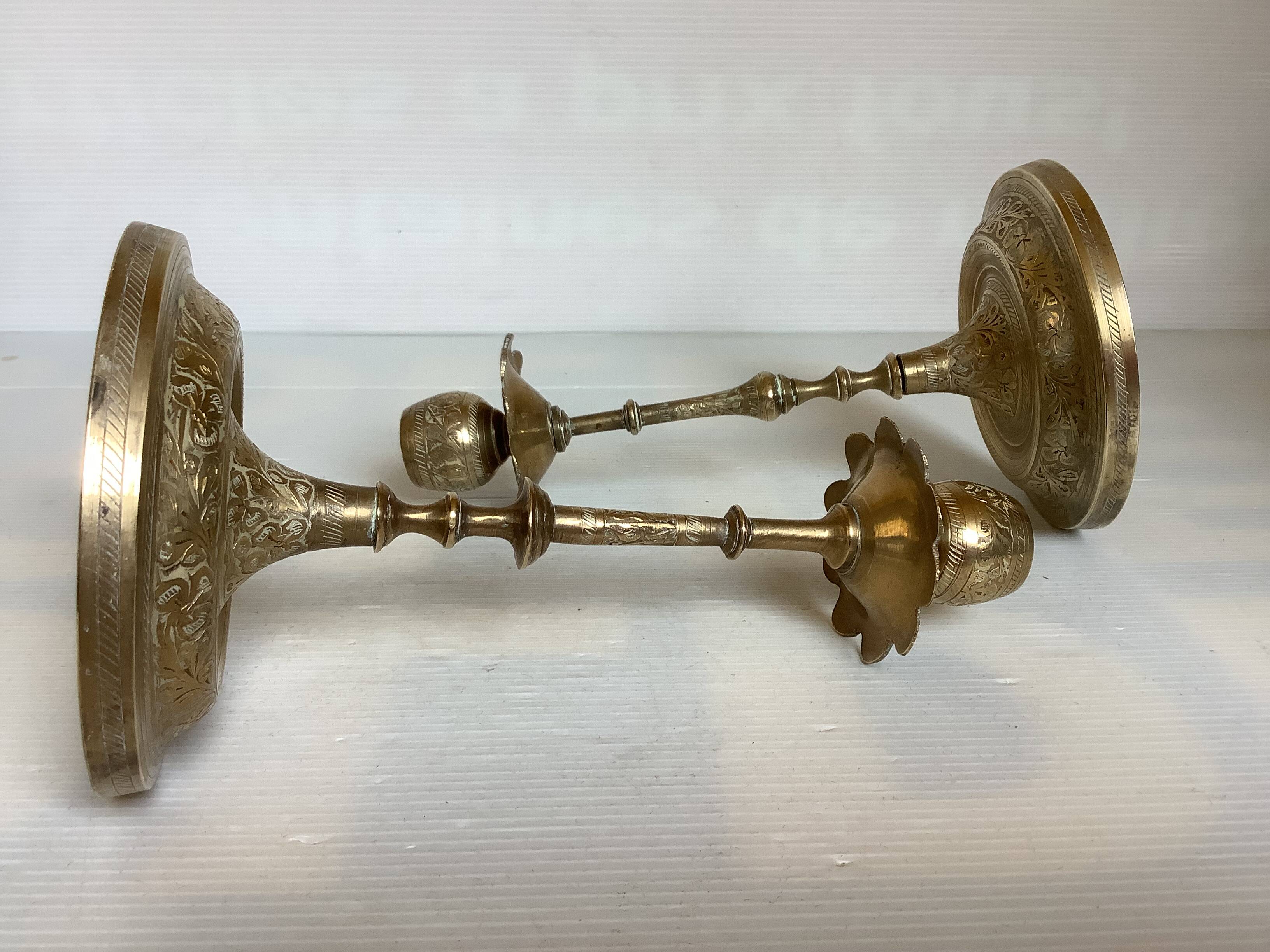 Pair of brass candlesticks with worked flower balls.