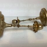 Pair of brass candlesticks with worked flower balls.