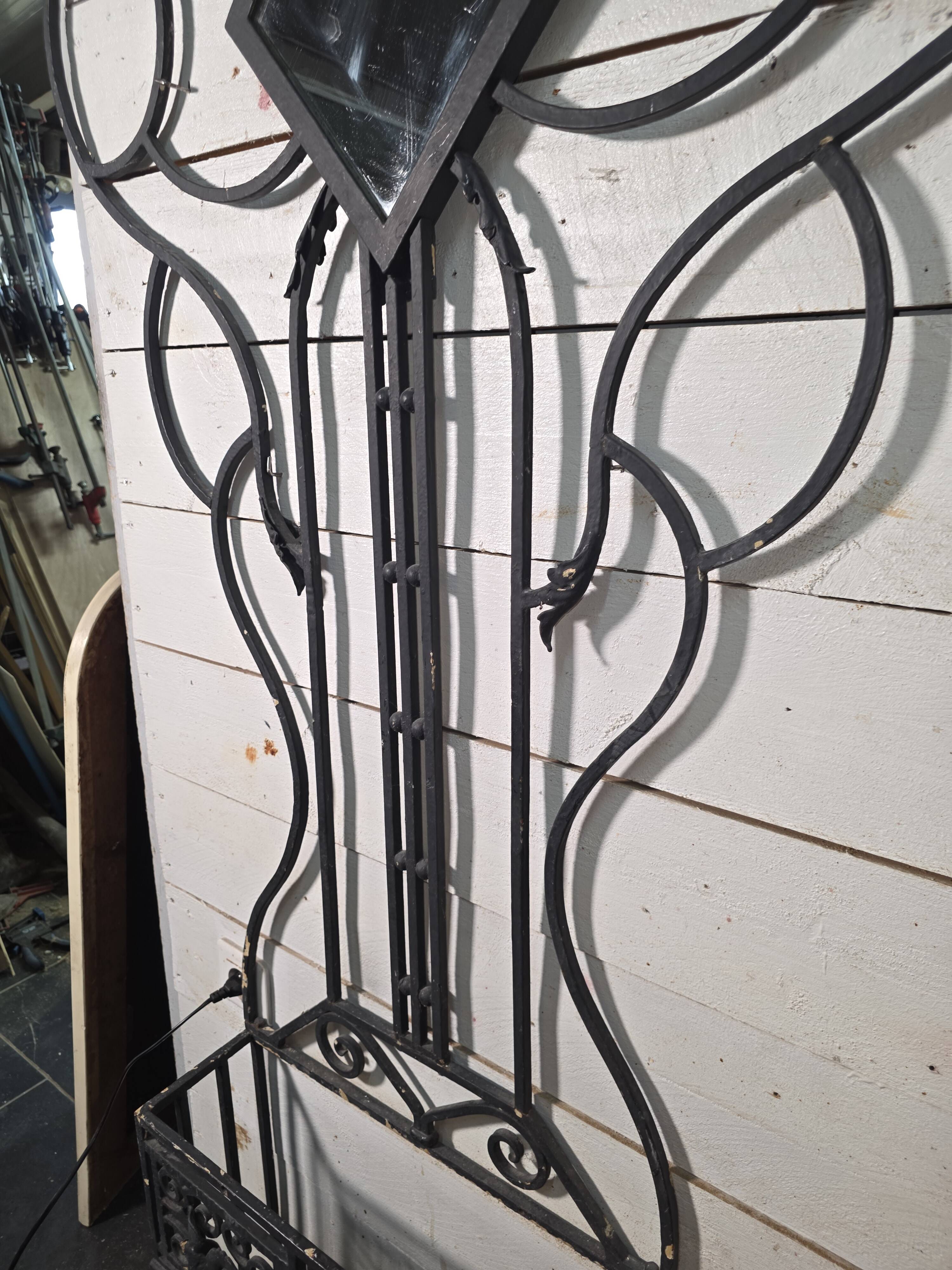 Art Deco coat rack wardrobe in wrought iron from the 1930s.