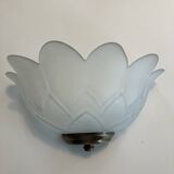 Pair of glass shell wall sconces with brass frames