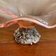 Pink blown glass cup on foot grape decoration