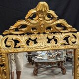 Large italian mirror in carved and gilded wood