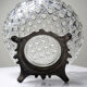 Pressed glass coupe with diamond points, antique from 1920-1950 on a pewter base.