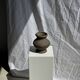Small brutalist handcrafted terracotta vase with a pedestal, Indonesian, H19 D17.