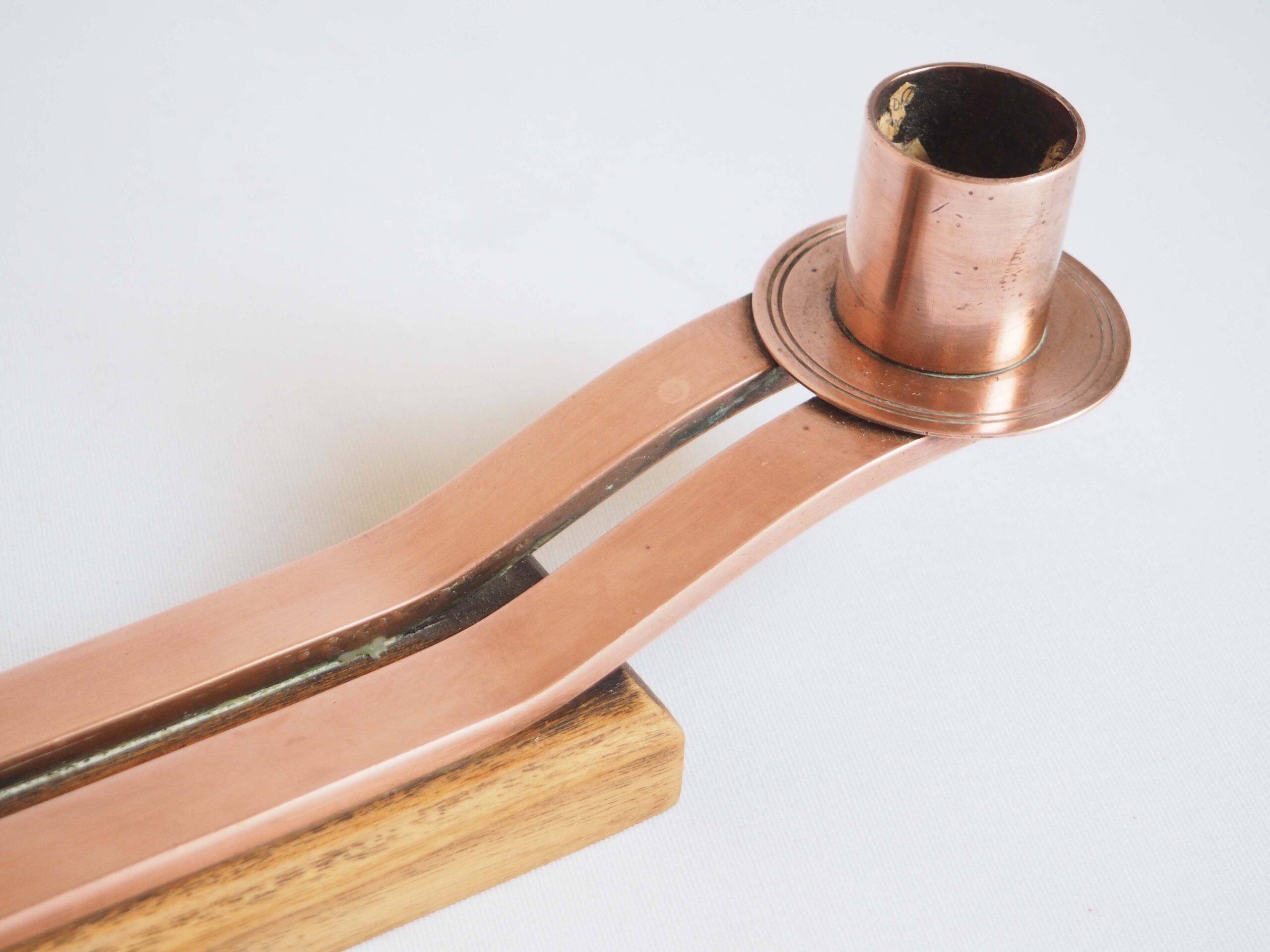 Pair of oak and copper bronze candlesticks