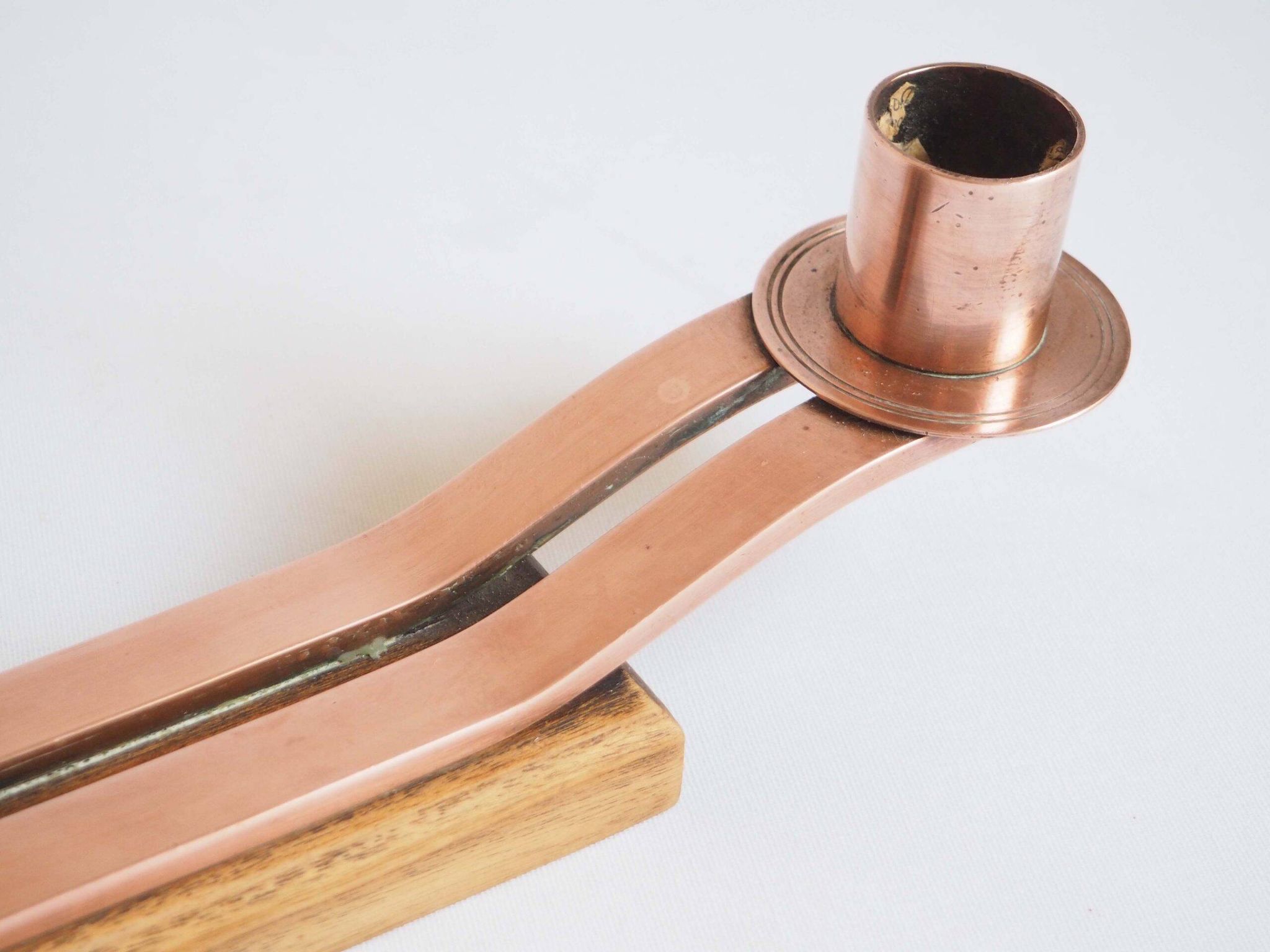 Pair of oak and copper bronze candlesticks
