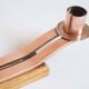 Pair of oak and copper bronze candlesticks