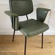Vintage chair with green imitation leather armrests