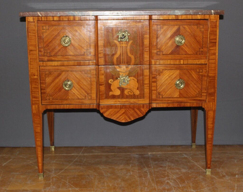 Louis XVI style chest of drawers with music attributes