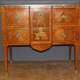 Louis XVI style chest of drawers with music attributes