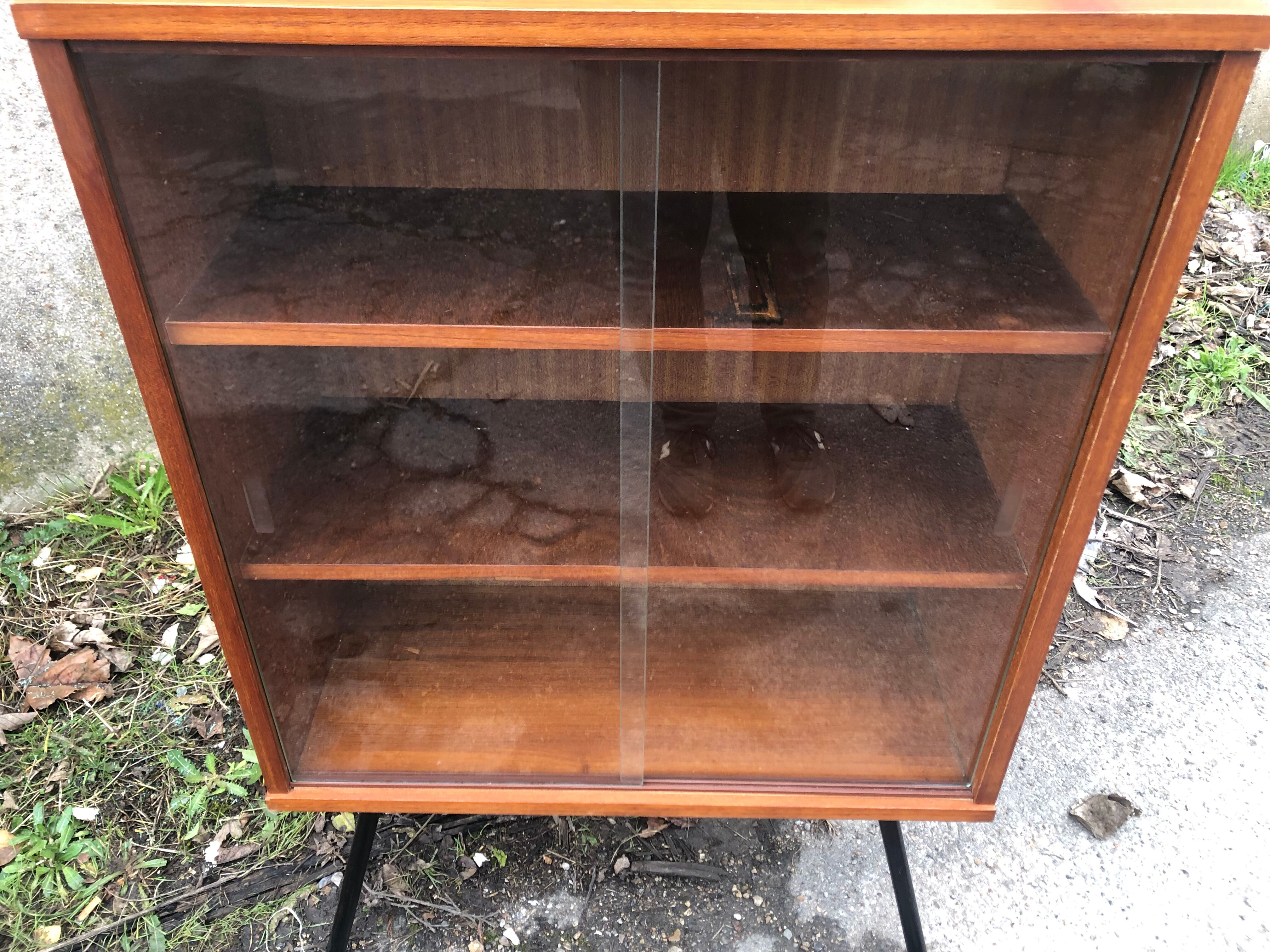 Library showcase with sliding glass doors 60s