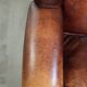 Comfortable cowhide wingback armchair in English style