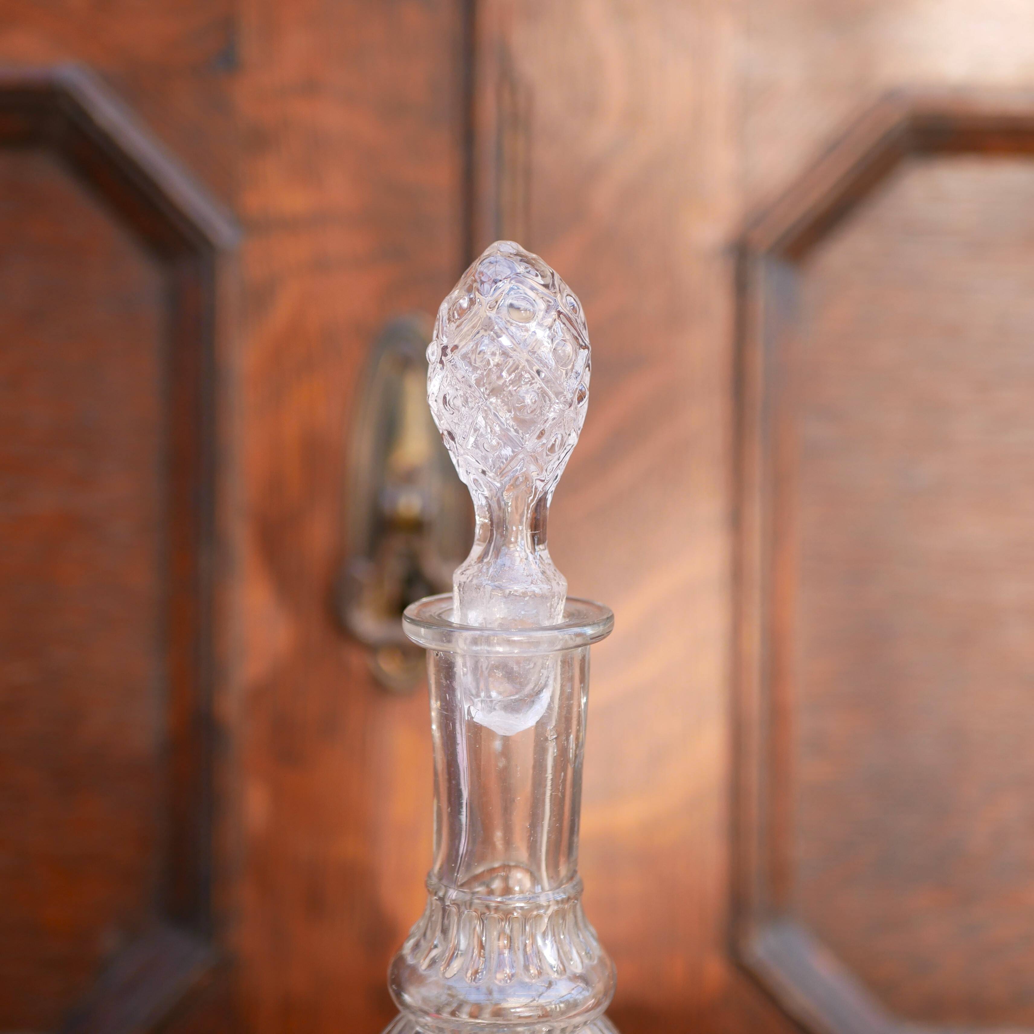 Cut glass liqueur decanter with decorated stopper