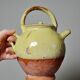Small vintage pale yellow enamelled terracotta goat jug