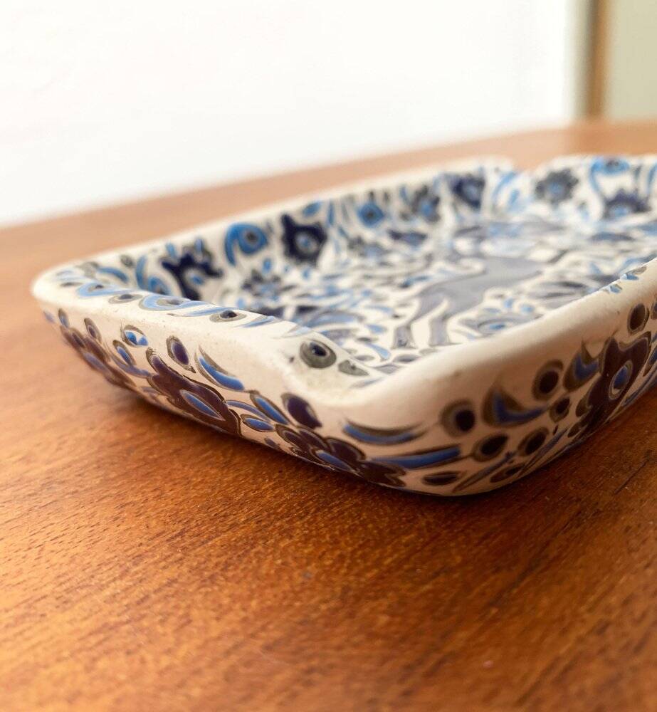 Vintage handmade blue ceramic ashtray with deer and flower ornament from Rodos Ceramics.