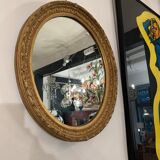 Old oval mirror, period XIXth