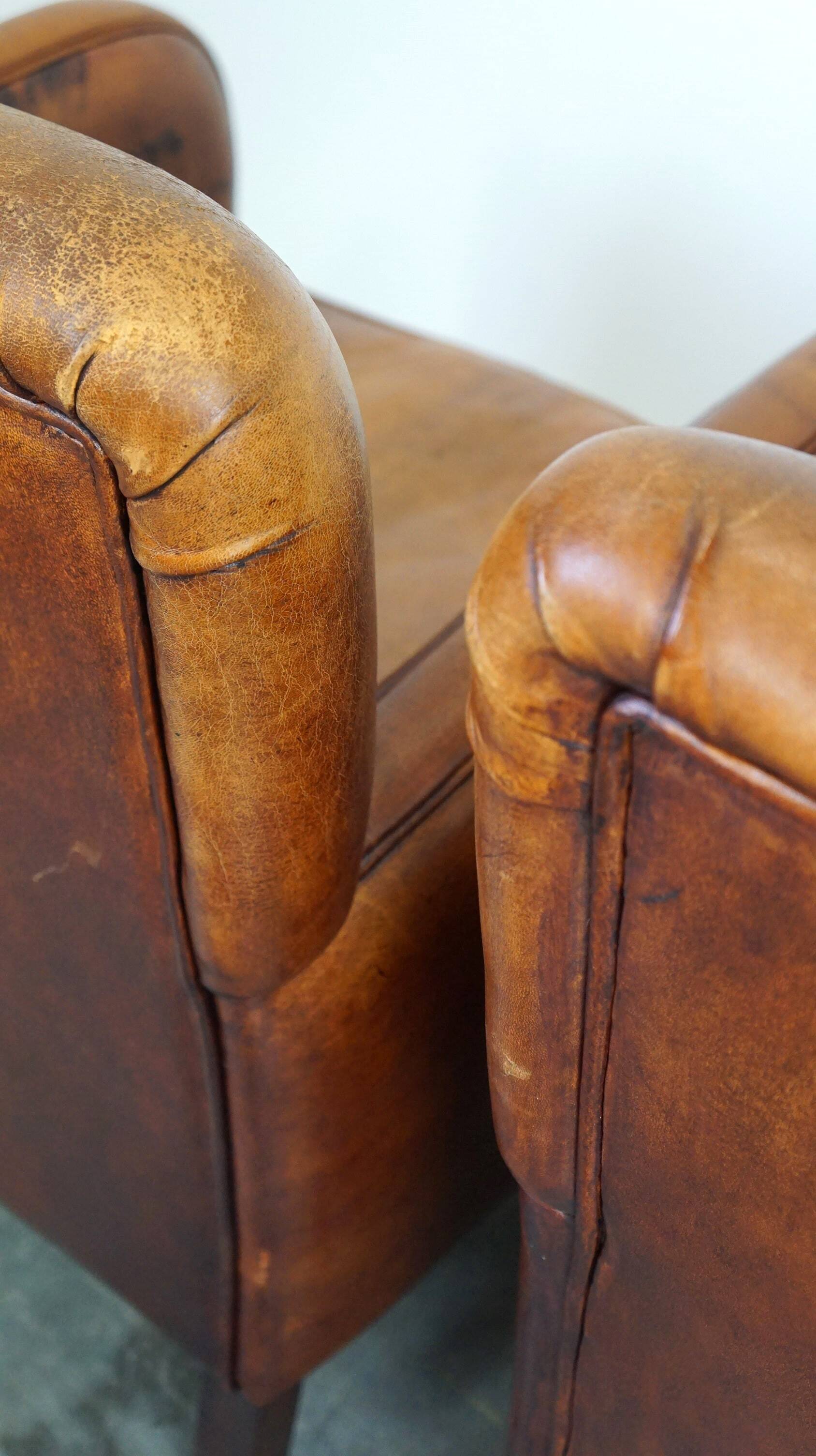 Set of 2 subtle sheepskin leather armchairs with a beautiful warm color scheme