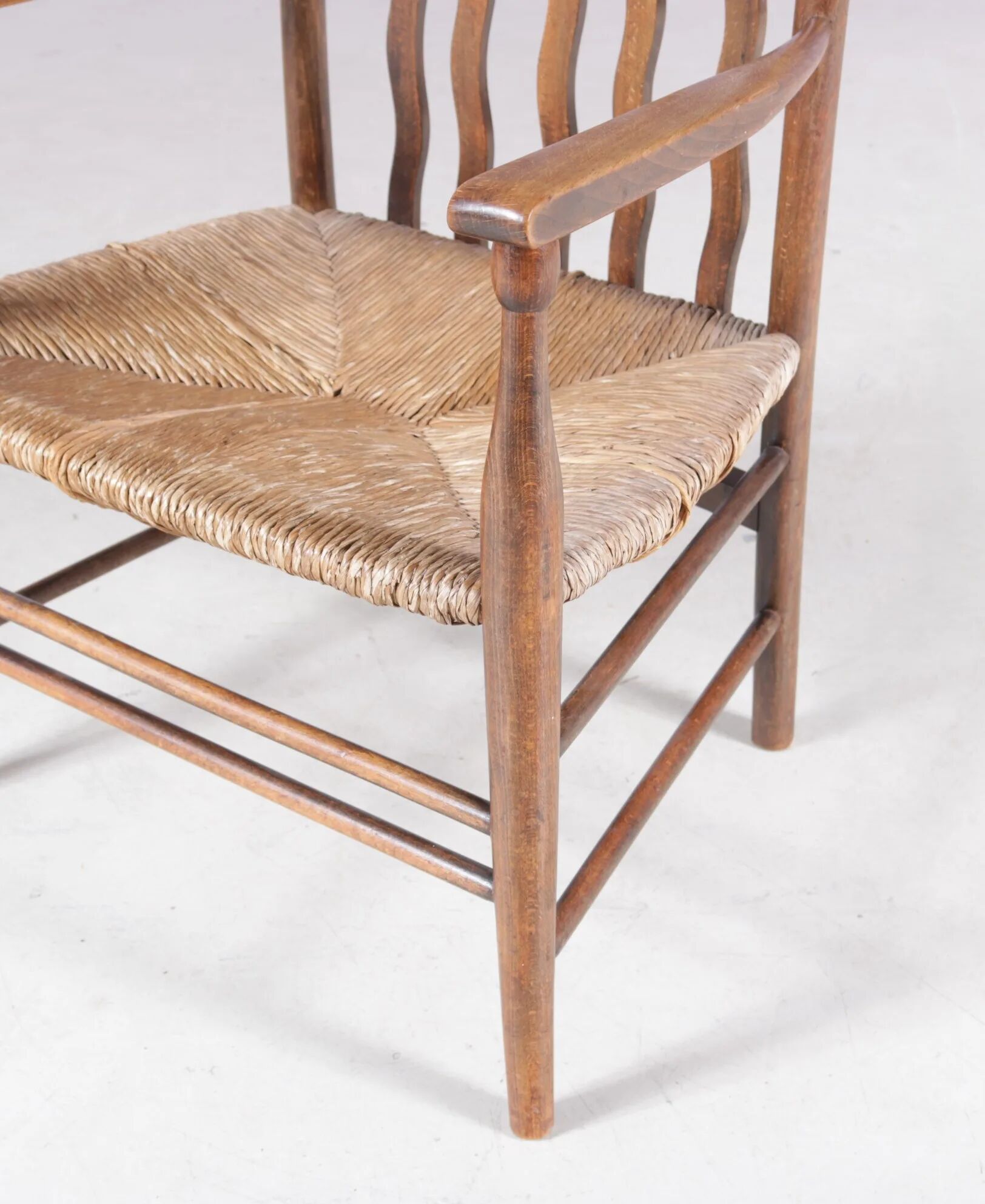1930s small low spindle-back hearth chair / side chair with wicker seat, Arts & Craft Movement, Morris & Co for Liberty and Co, Stowaway London