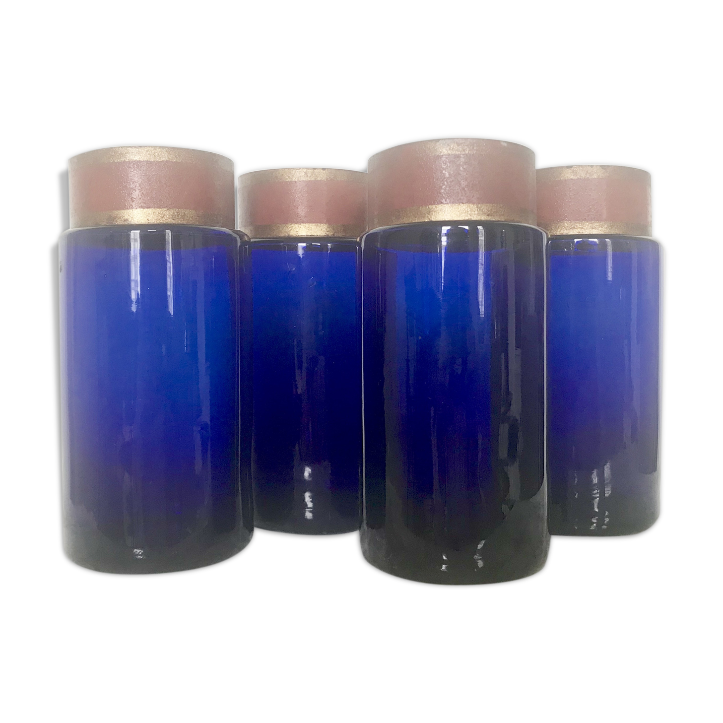Suite of four bottles of ancient apothecary in blue breath glass