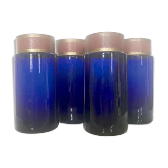 Suite of four bottles of ancient apothecary in blue breath glass