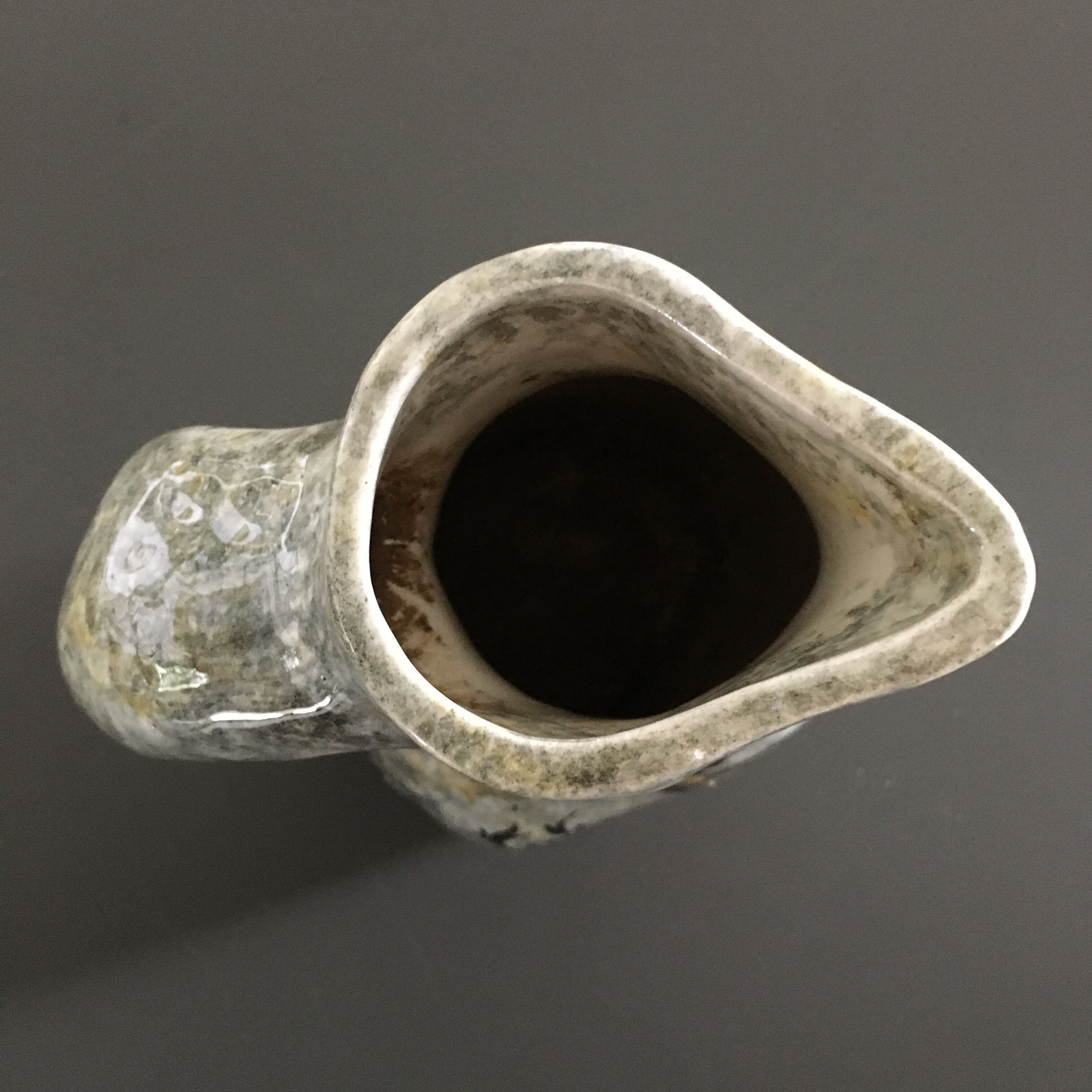 Zoomorphic pitcher with wall decoration