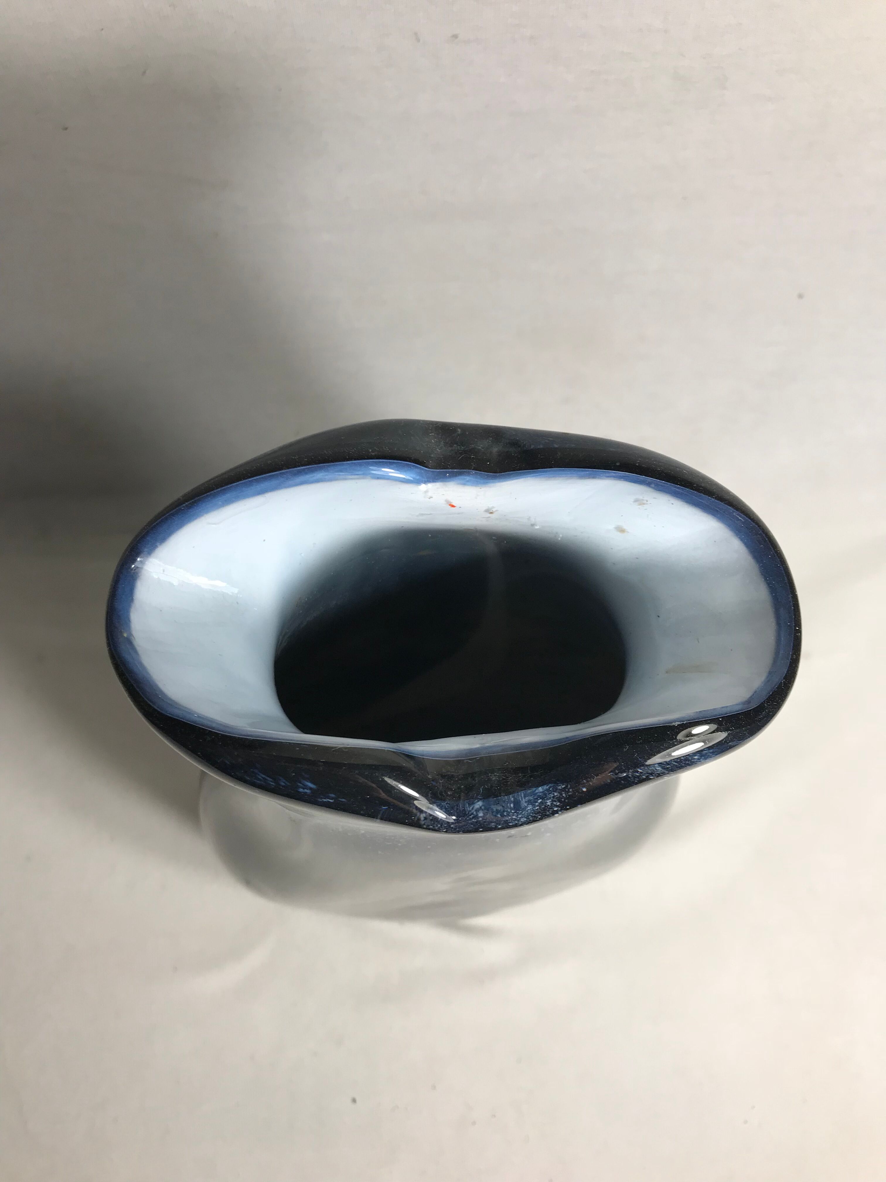 Old glass vase multilayer blue, white vintage interior