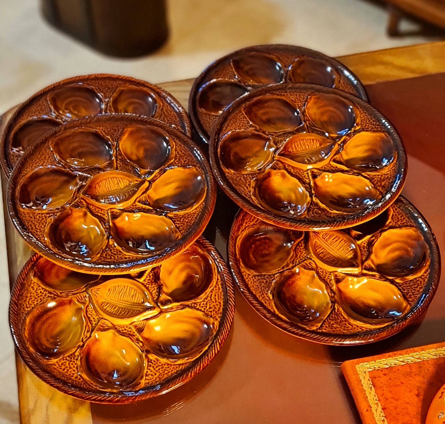 Six oyster plates signed Saint Clément