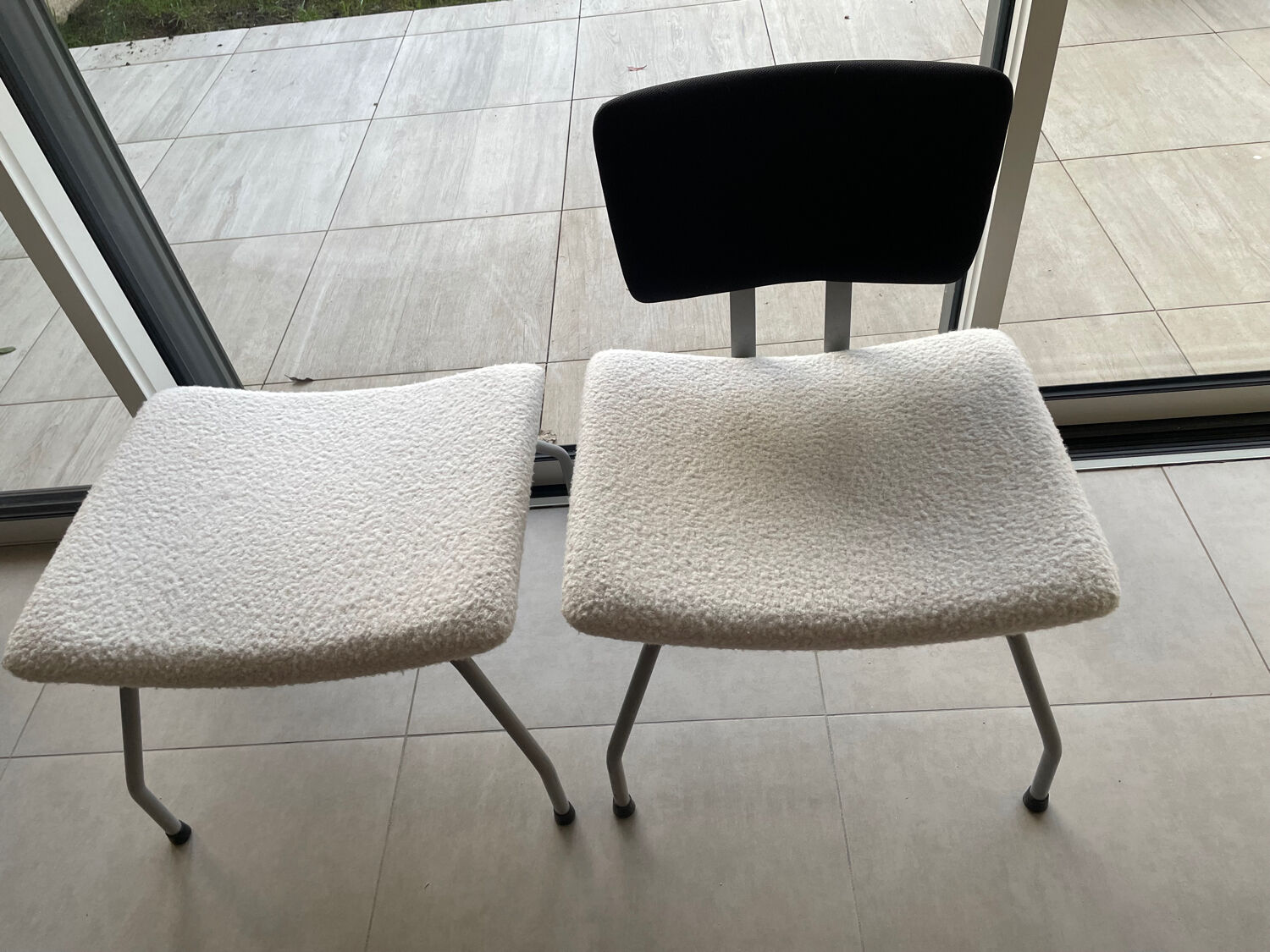 Armchair and footrest in boucle wool.