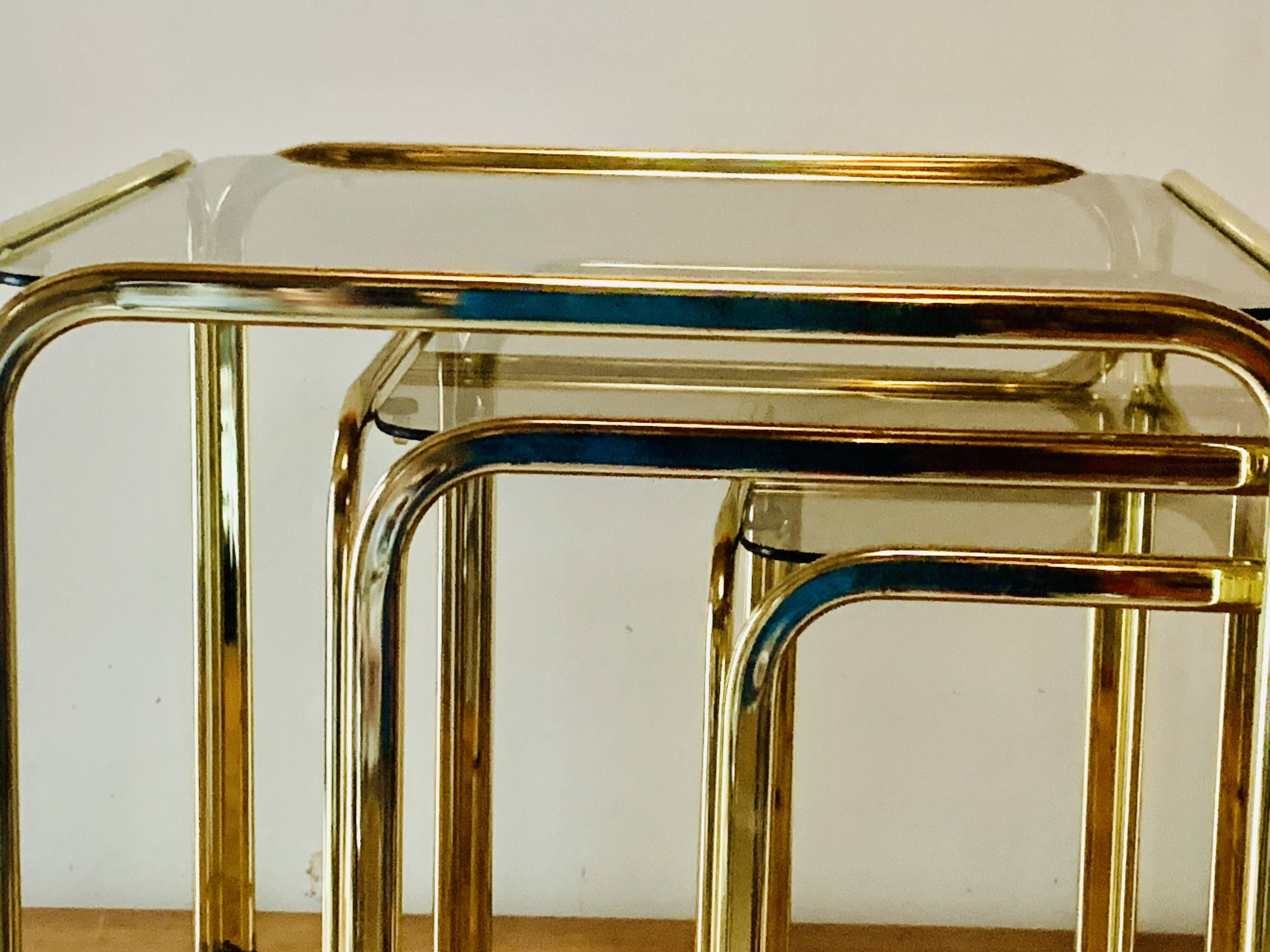 Vintage nesting tables in gold metal and smoked glass