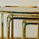 Vintage nesting tables in gold metal and smoked glass