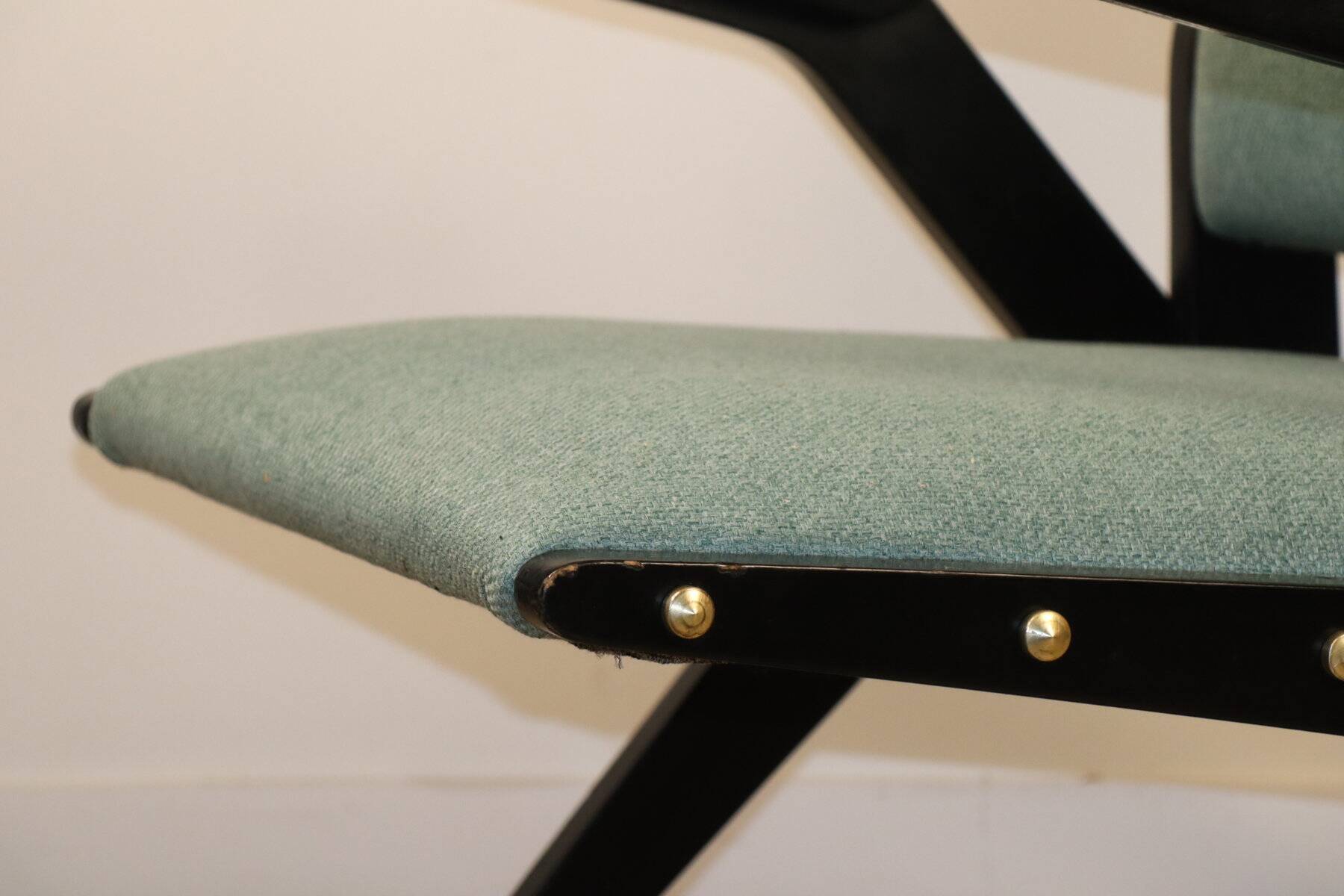 Vintage armchair from the 1960s in black wood and fabric.