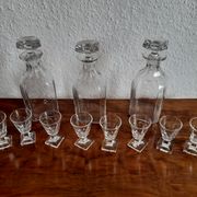 Old-fashioned glass liquor cellar and St Louis crystal decanters