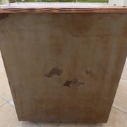 Vintage industrial metal furniture with a rusty effect, featuring two drawers on wheels.