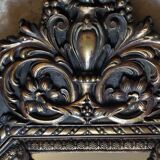 Old octagonal mirror with brass glazing beads