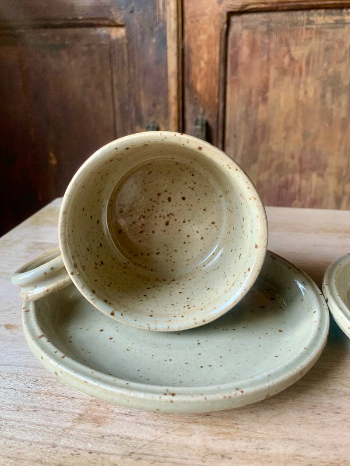Two large Jean Austruy stoneware cups and saucers