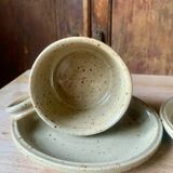 Two large Jean Austruy stoneware cups and saucers