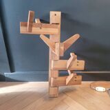 Articulated vertical wall coat rack