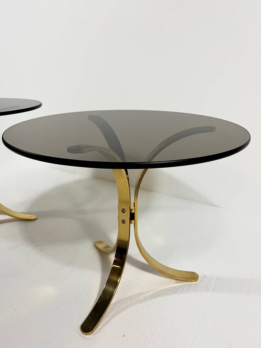 Brass and smoked glass side tables from the 1960s.
