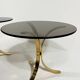 Brass and smoked glass side tables from the 1960s.