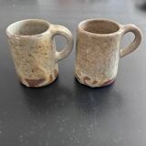 Pair of signed stoneware mugs
