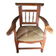 Beau fauteuil ancien au dossier haussable et assise en paille